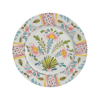 Add Amalfi Coast flair to your table with Duggan Society’s Sorrento Dinnerware Collection, featuring a white ceramic plate adorned with pink, yellow, green, and blue floral and leaf patterns plus Italian-inspired geometric borders.