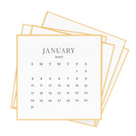 A square, letterpress-printed 2027 Desk Calendar page for January with gold borders.