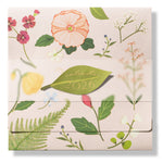 The 2026 Classic Desk Calendar Collection by Karen Adams features a floral design on a light background with illustrated flowers, leaves, and a green leaf-shaped "calendar 2026" label—an ideal gift inspired by best-selling calendar styles.