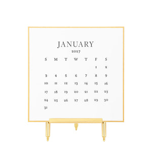 Sugar Paper 2027 Desk Calendar page, letterpress printed on extra thick card stock and displayed on a gold easel stand.