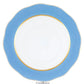 The Silk Ribbons Charger by Herend features a round ceramic design with a wavy blue rim, gold inner trim, and a white center—an elegant choice to elevate any tabletop setting.