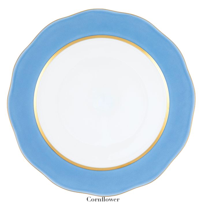 The Silk Ribbons Charger by Herend features a round ceramic design with a wavy blue rim, gold inner trim, and a white center—an elegant choice to elevate any tabletop setting.