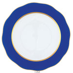 The Herend Silk Ribbons Charger is a round handmade porcelain plate, white with a cobalt blue scalloped rim and gold trim, shown from above.