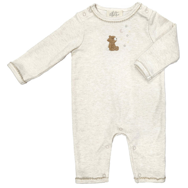 Introducing the Albetta Romper, Dreaming Teddy by Albetta: An infant's long-sleeve, light beige onesie with convenient snap buttons on the shoulders and at the bottom. This adorable outfit features an applique teddy and bubbles on the chest, meticulously crafted from sustainable organic cotton.