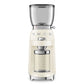 The Smeg Coffee Grinder, from the SMEG Coffee Grinder Collection, in cream, features a clear hopper and container with a shiny metallic side knob for perfect grind adjustments.