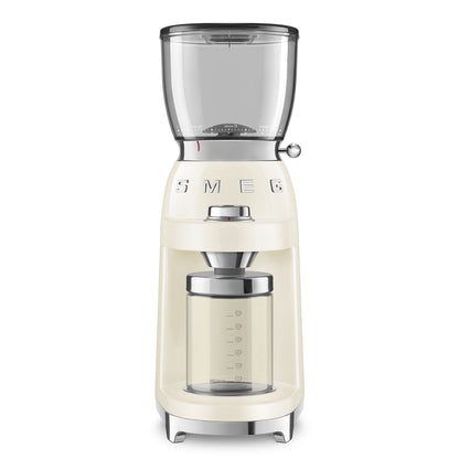 The Smeg Coffee Grinder, from the SMEG Coffee Grinder Collection, in cream, features a clear hopper and container with a shiny metallic side knob for perfect grind adjustments.