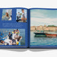 An open book from Assouline featuring images of people fishing near two boats on tranquil waters by a seaside town. Captions on the left page highlight Cheval Blanc's bespoke service and luxury hospitality.