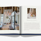A book from Assouline, titled "Cheval Blanc," reveals a modern interior on the left and someone arranging items on a table on the right, showcasing bespoke luxury hospitality reminiscent of Cheval Blanc experiences.