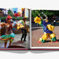 An open book titled "Santo Domingo" by Assouline reveals dancers in colorful costumes. One page captures a couple dancing indoors, while the other showcases a figure in a vibrant costume performing near the Malecón.