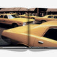 An open Assouline "5th Avenue" photo book displays yellow taxis on a vibrant city street, with bustling pedestrians and iconic buildings in the background.