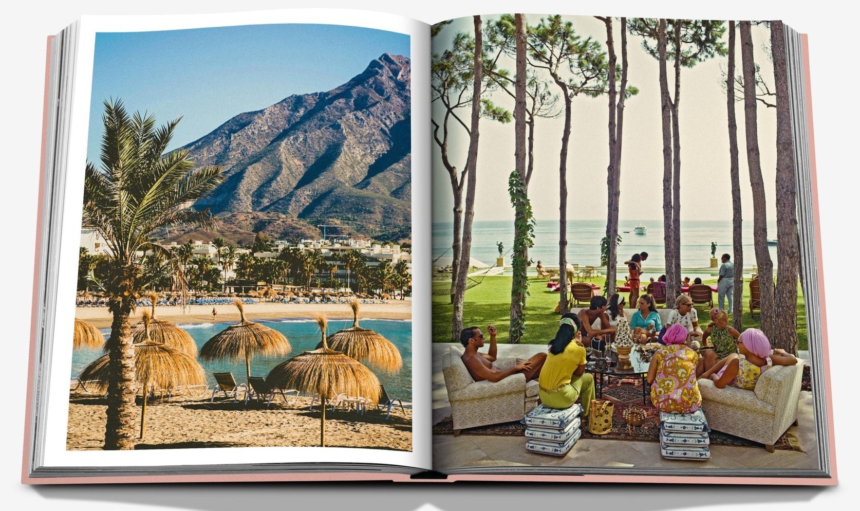 An open copy of Assouline's Marbella Sol displays a beach scene with straw umbrellas on the left and people relaxing by the ocean on the right.