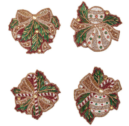 Kim Seybert Candy Cane Bow Coasters featuring four beaded designs with decorative bows, ornaments, candy canes, and evergreen sprigs.