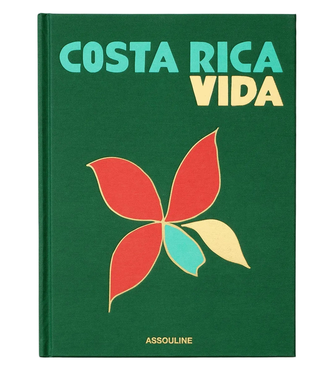 Green book cover titled “Costa Rica Vida” featuring a stylized flower graphic that embodies the spirit of Pura Vida, with the brand name Assouline displayed at the bottom.