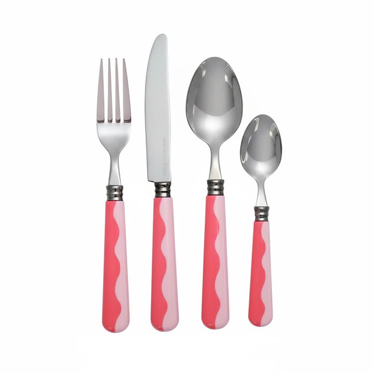 A fork, knife, tablespoon, and teaspoon with pink and white wavy handles from the Addison Ross Wave Flatware Collection are arranged side by side on a white background.