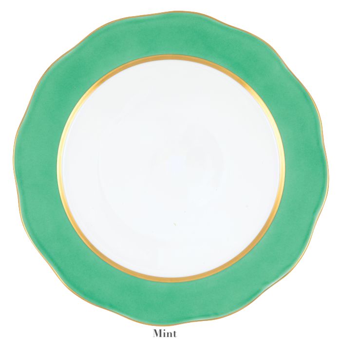 A white plate with a mint green scalloped rim and gold trim, perfect for elevating any table setting or pairing beautifully with the Herend Silk Ribbons Charger.