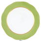 The Herend Silk Ribbons Charger is a handmade porcelain round plate featuring a wavy olive green rim, gold inner band, and white center—ideal for elevating any tabletop setting.