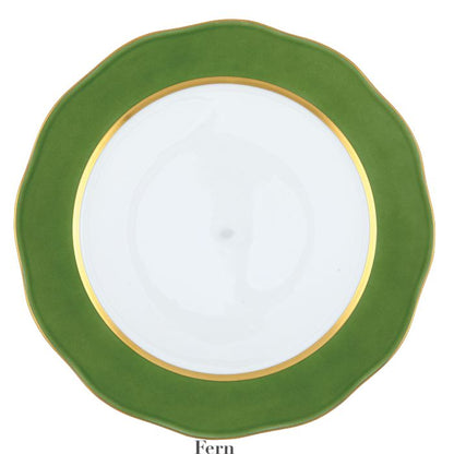 A handmade porcelain plate with a wavy green border and gold rim, shown from above—perfect for enhancing your table or pairing with the Herend Silk Ribbons Charger.