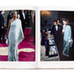 An open book, "Caftans: From Classical to Camp" by Vendome, reveals images of a person in a stunning caftan couture on a red carpet and two people admiring resort-themed jewelry.