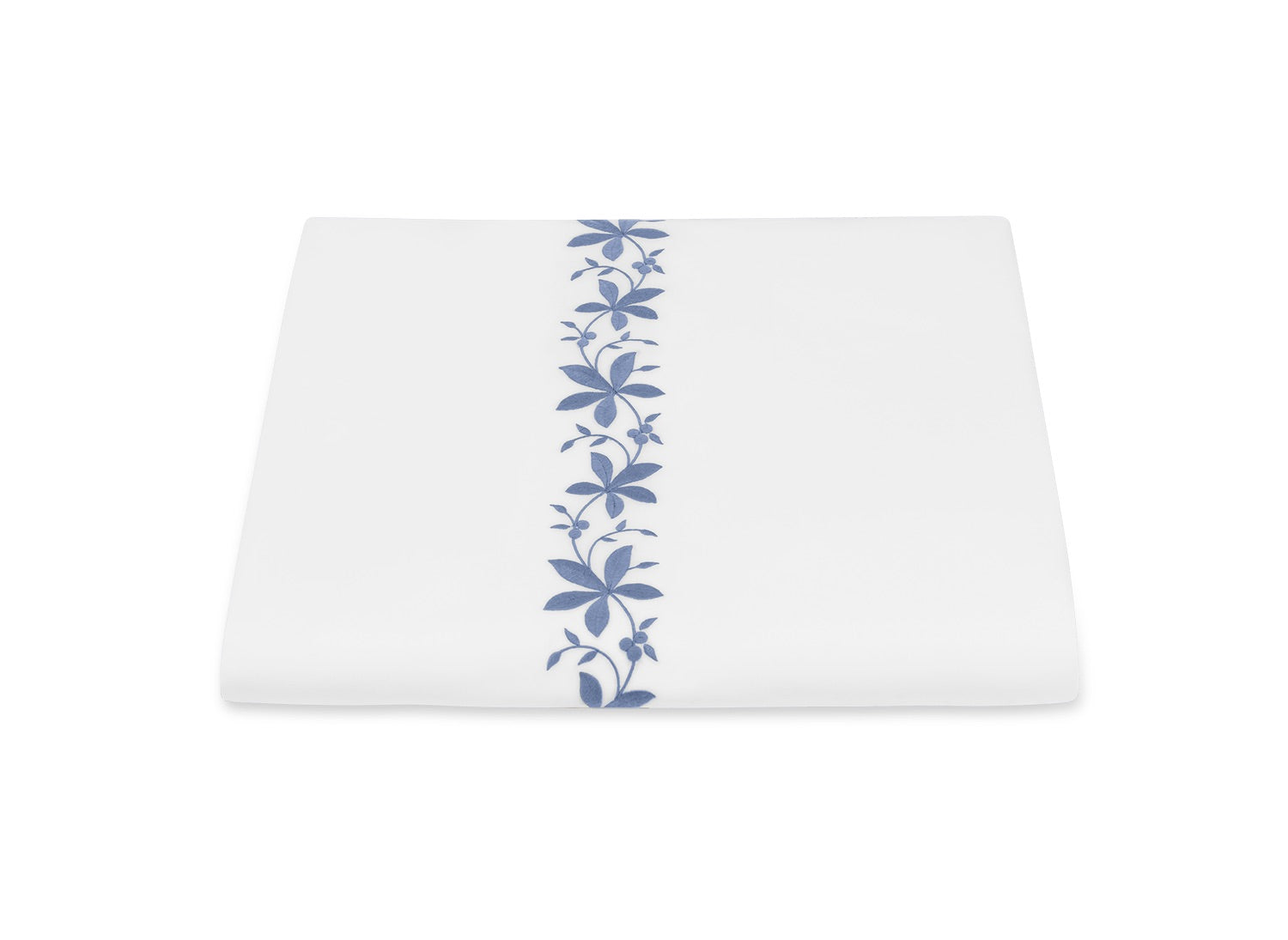 Luxury white bedding from Matouk’s Callista Bedding Collection, featuring a vertical row of blue floral embroidery down the center and crafted from sumptuous Giza Egyptian cotton for a refined, elegant look.