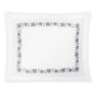 A white rectangular plate with a border of purple floral patterns resembling decorative embroidery from the Matouk Callista Bedding Collection, featuring delicate floral vines, viewed from above against a plain white background.