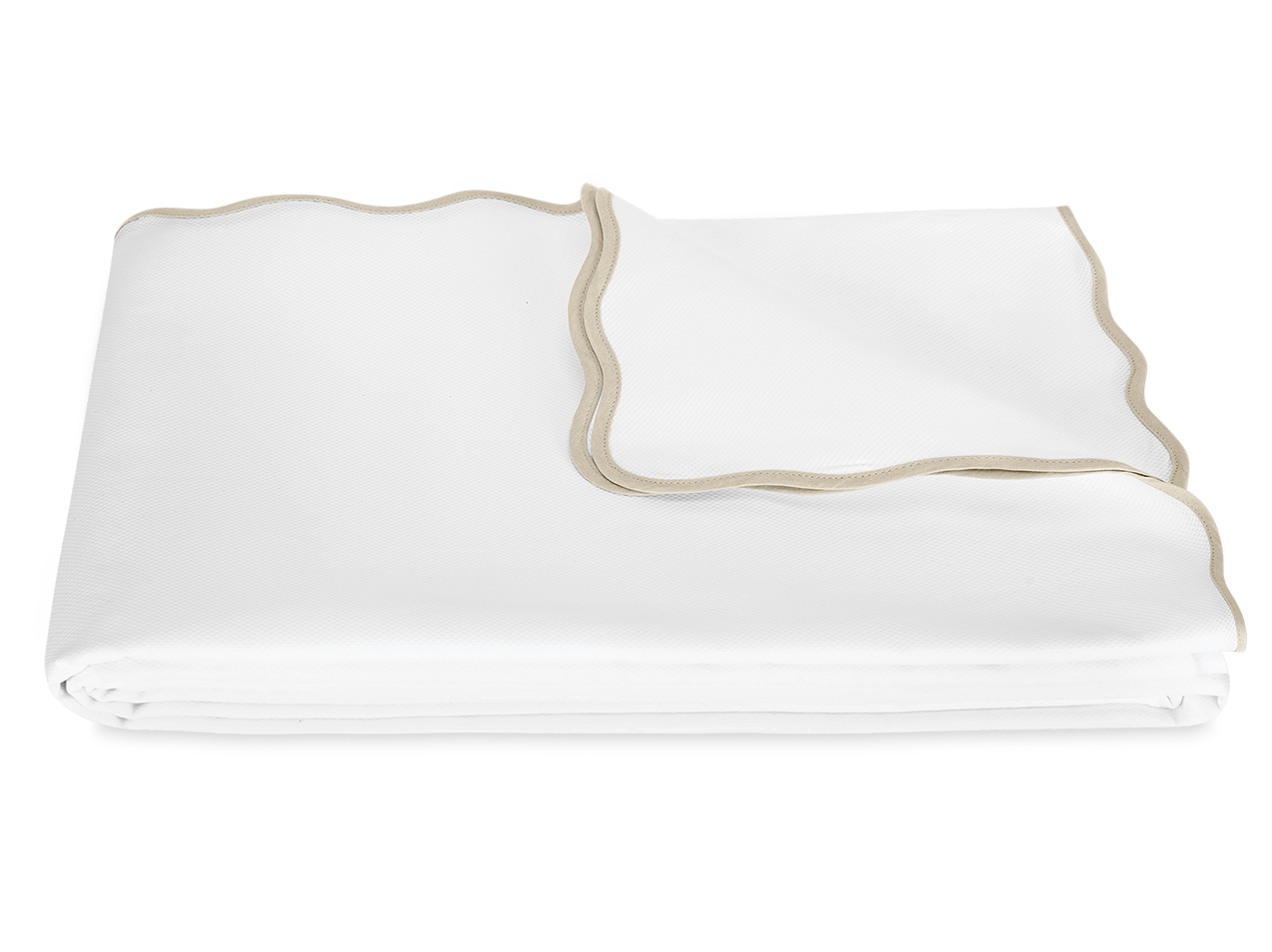 The Camilla Pique Coverlet by Matouk is a neatly folded white blanket with beige trim and a delicate scallop edge, displayed on a plain white background.