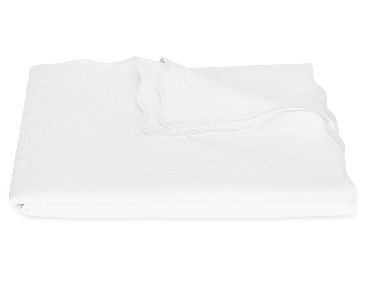 The Camilla Pique Coverlet by Matouk, crafted from pure cotton with smooth, slightly wavy edges, is neatly folded and displayed on a plain white background.