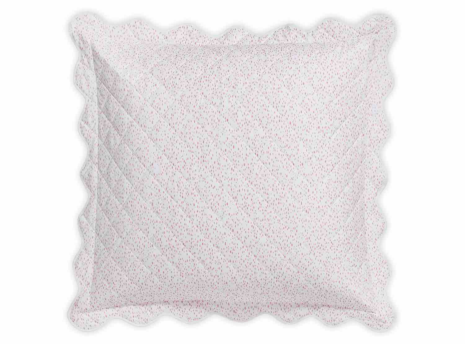 The Matouk Celine Bedding Collection, Pink, features a square decorative pillow with scalloped edges crafted from Egyptian cotton percale and adorned with small pink and red dots on a white background.