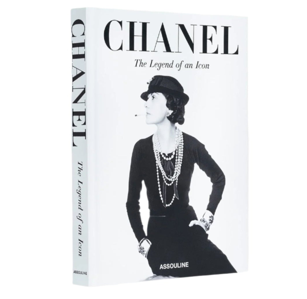 Chanel: The Legend of an Icon," by Assouline, features a classic black-and-white cover with a woman wearing a hat and pearls, capturing the essence of modern fashion.