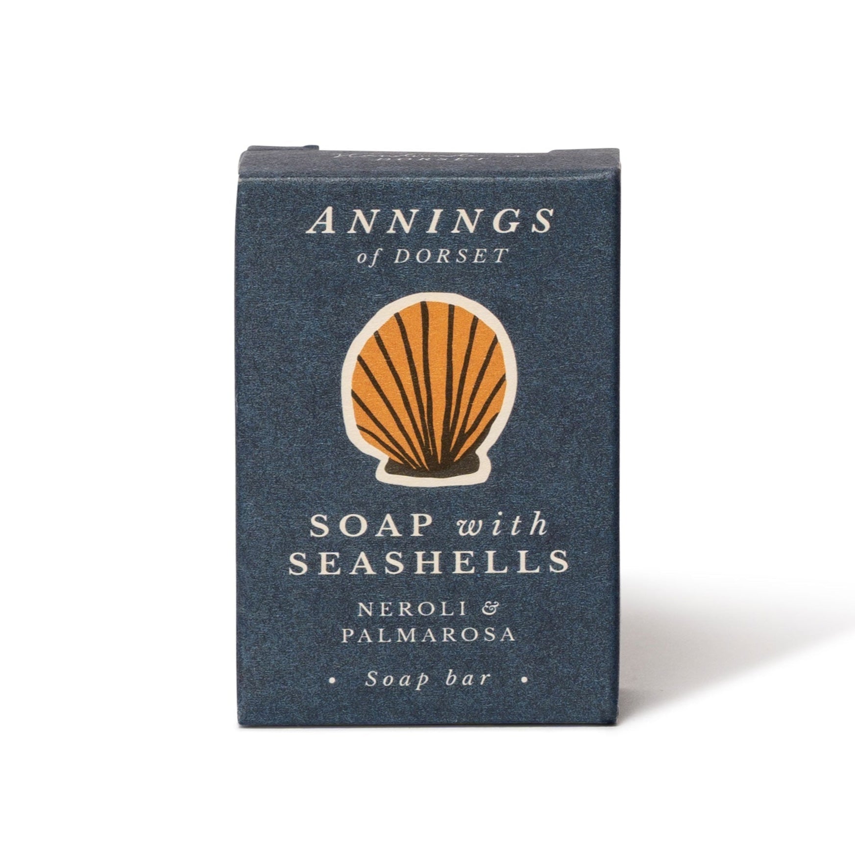 A dark blue box labeled "The Chic Gift Hamper" by Sharland England, featuring an orange seashell illustration—an ideal sustainable soap gift for those seeking thoughtful and artisanal presents.