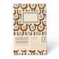 The Chic Gift Hamper by Sharland England includes a stylish hardback notebook with a brown and blue pattern, a blank cover label, and a branded sleeve—ideal for pairing with artisanal treats like hand-poured candles.