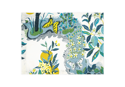 A folded fabric napkin from the Citrus Garden Pool Collection by Matouk, featuring a botanical and butterfly print in blue, green, yellow, and white inspired by Josef Frank’s designs.