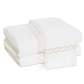 Two folded Matouk Classic Chain Bath Collection towels in Cairo cotton terry, featuring beige chain embroidery and matching trim, displayed on a white background.