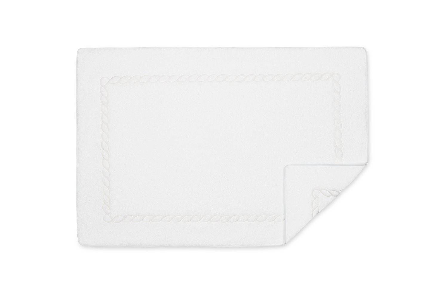 A white rectangular bath mat from Matouk's Classic Chain Bath Collection, made of plush Cairo cotton terry with a subtle chain border and one corner neatly folded over.