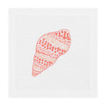 Haute Home’s Speckled Conch Coaster Set pairs perfectly with a white cloth napkin featuring an embroidered orange and pink seashell for a stylish, coastal-inspired table setting.