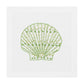 The Speckled Shell Coaster Set by Haute Home features coasters with a green and yellow hand-embroidered seashell design on white Italian linen.