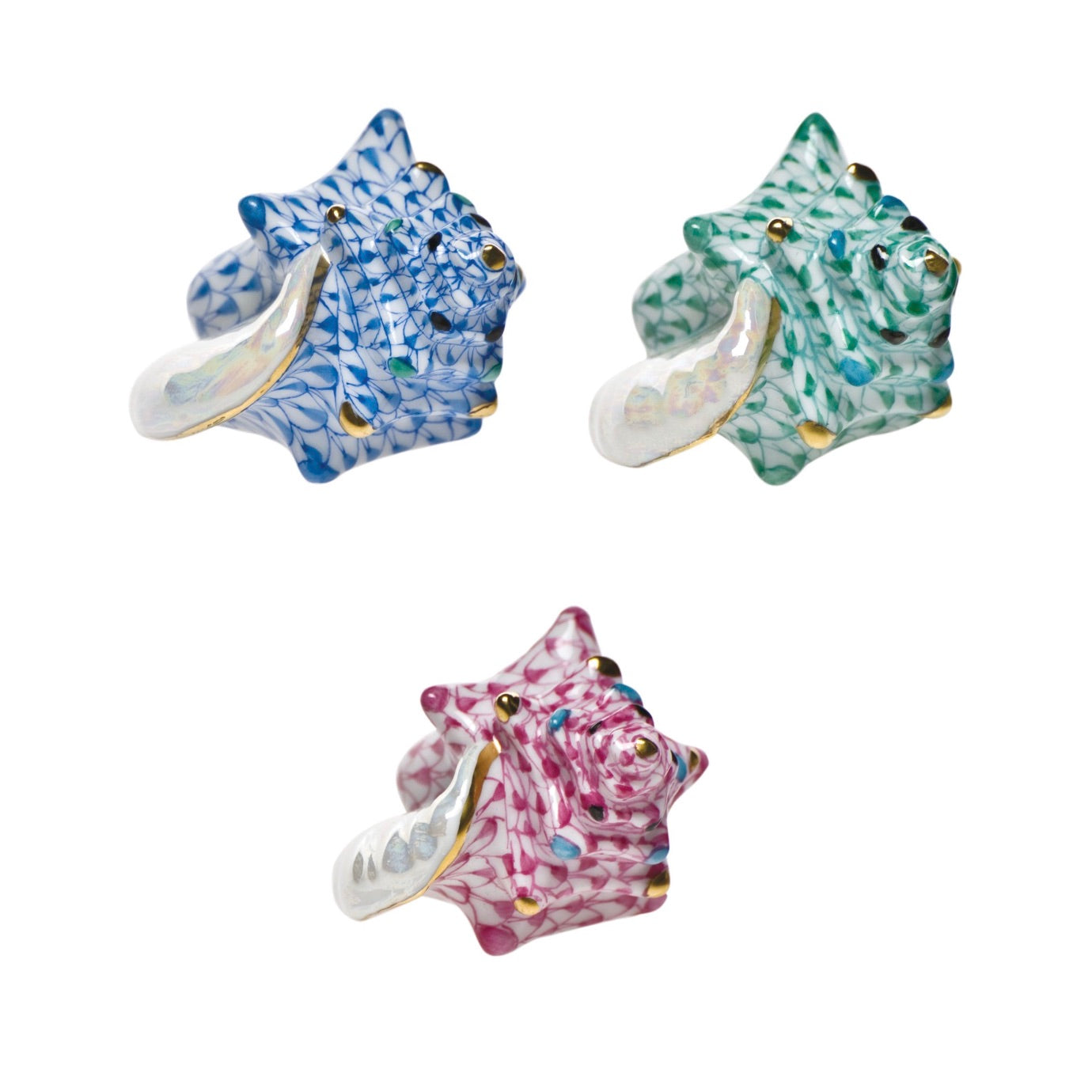 Three Herend Small Conch Shell ceramic rings—one blue, one green, and one pink—feature hand-painted designs, gold accents, and patterned surfaces for artistic display on a white background.