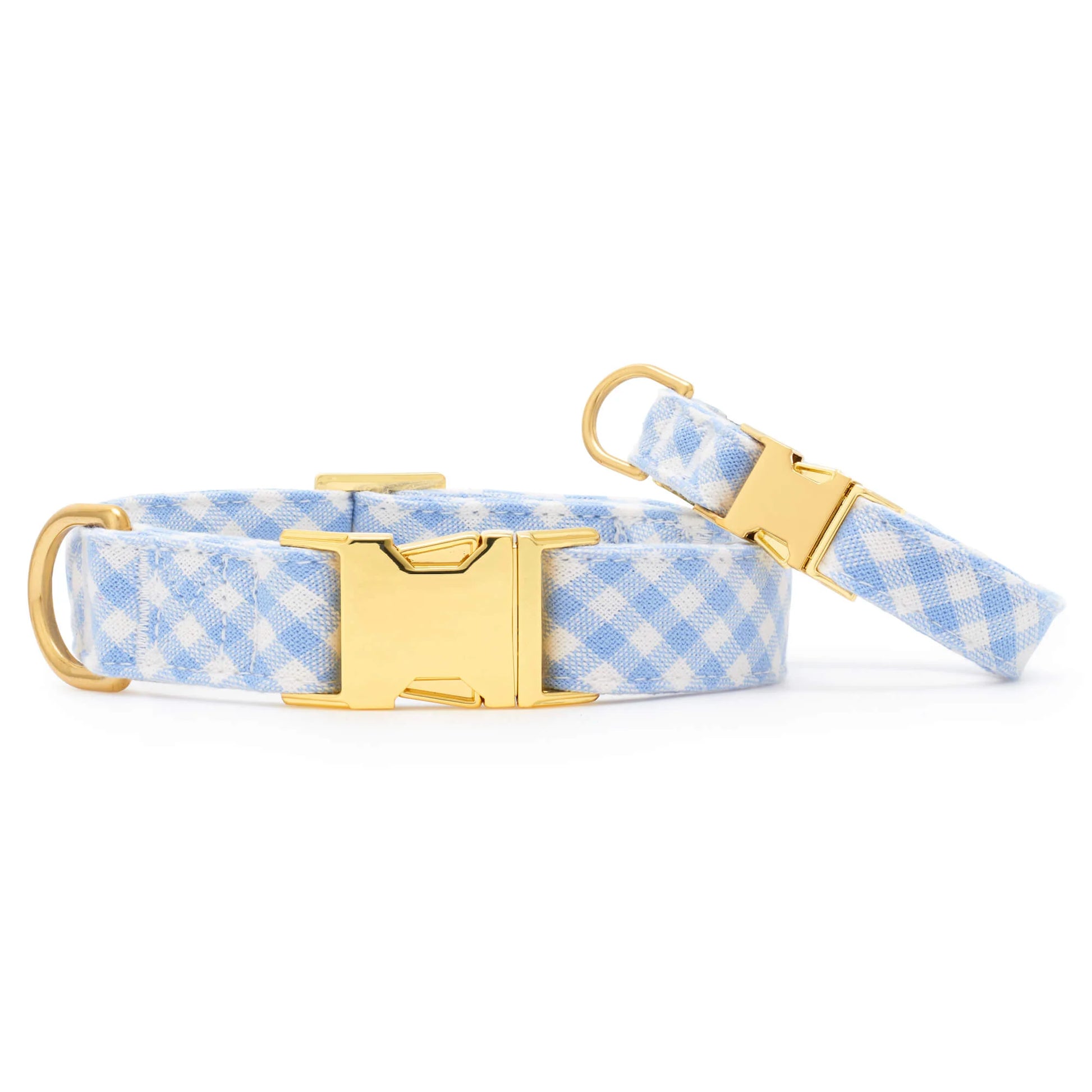 Two Sky Blue Gingham Spring Dog Collars by The Foggy Dog feature gold metal buckles and D-ring hardware, shown on a white background.