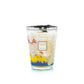 The Baobab Collection Cities Côte d’Azur Candle by Baobab comes in a glass container with colorful, intricate screen-printed decor and a black ribbon on top. The label reads “Baobab Collection Côte d’Azur.”.