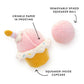 The Foggy Dog Cupcake 2-in-1 Bounce Dog Toy features crinkle frosting, a squeaker inside the cupcake, and a removable spiked squeaker ball for extra fun.