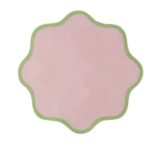 The Daisy Table Linen Collection by Duggan Society features a pink, scalloped-edged design with a green border, reminiscent of elegant table linens, set against a white background.
