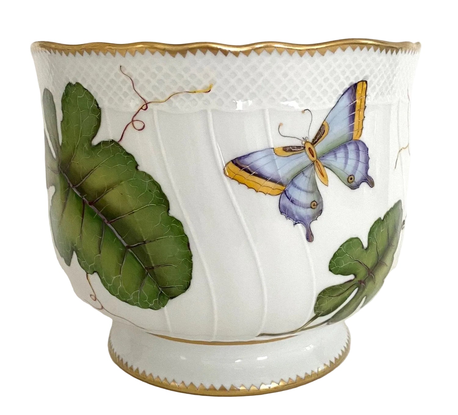The Anna Weatherley Leaf Cachepot is a white porcelain piece with gold trim, featuring hand-painted green leaves and a blue-yellow butterfly—a stunning example of Hungarian artistry.