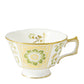 The Derby Panel Green Dinnerware Collection by Royal Crown Derby features a white porcelain teacup with a gold rim, ornate handle, and green and yellow floral patterns, showcasing British fine bone china craftsmanship.