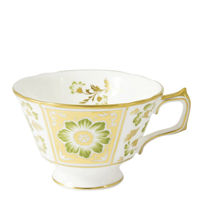The Derby Panel Green Dinnerware Collection by Royal Crown Derby features a white porcelain teacup with a gold rim, ornate handle, and green and yellow floral patterns, showcasing British fine bone china craftsmanship.