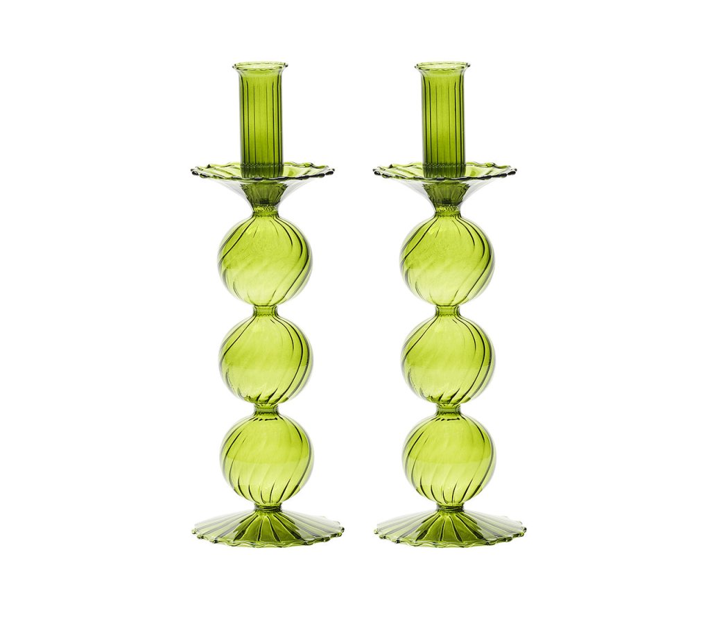 The Kim Seybert Iris Tall Candle Holder Set features two hand-blown green glass holders with stacked spheres and scalloped bases, displayed side by side on a white background.