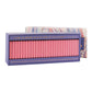 The Good Juju Ink Domino Set is a rectangular keepsake box with pink game pieces and a lid quote: “Life is more fun if you play games” by Roald Dahl—an ideal pick for design lovers.