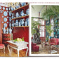 A book open to pages reveals an opulent interior filled with ornate furniture, red walls, and decorative blue and white porcelain items, exuding a Chinoiserie charm reminiscent of the elegance captured in Vendome's "Dragons & Pagodas: A Celebration of Chinoiserie.