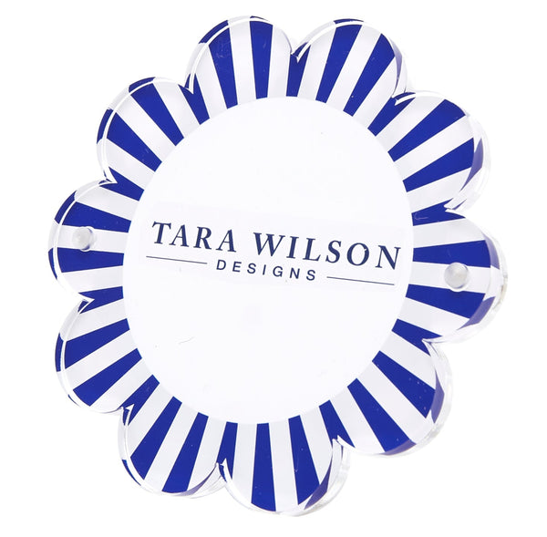 The Tara Wilson Daisy Frame by Tara Wilson Designs features a flower-shaped acrylic design with blue and white stripes—ideal for showcasing your 4x6 photo with added charm.