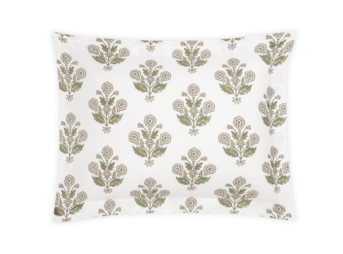 Square pillow from the Dalila Bedding Collection by Matouk, featuring a white background with a repeating green and beige floral pattern inspired by Schumacher block print.