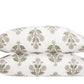 Two pillowcases from the Dalila Bedding Collection by Matouk, featuring a vibrant green and taupe botanical pattern inspired by a Schumacher block print, are stacked together against a plain white background.