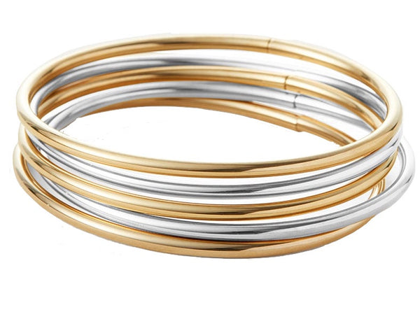 A collection of lightweight, silver and gold-toned Jenny Bird Dane Bangle 6" 5-Pack bracelets arranged in a stacking game against a white background.